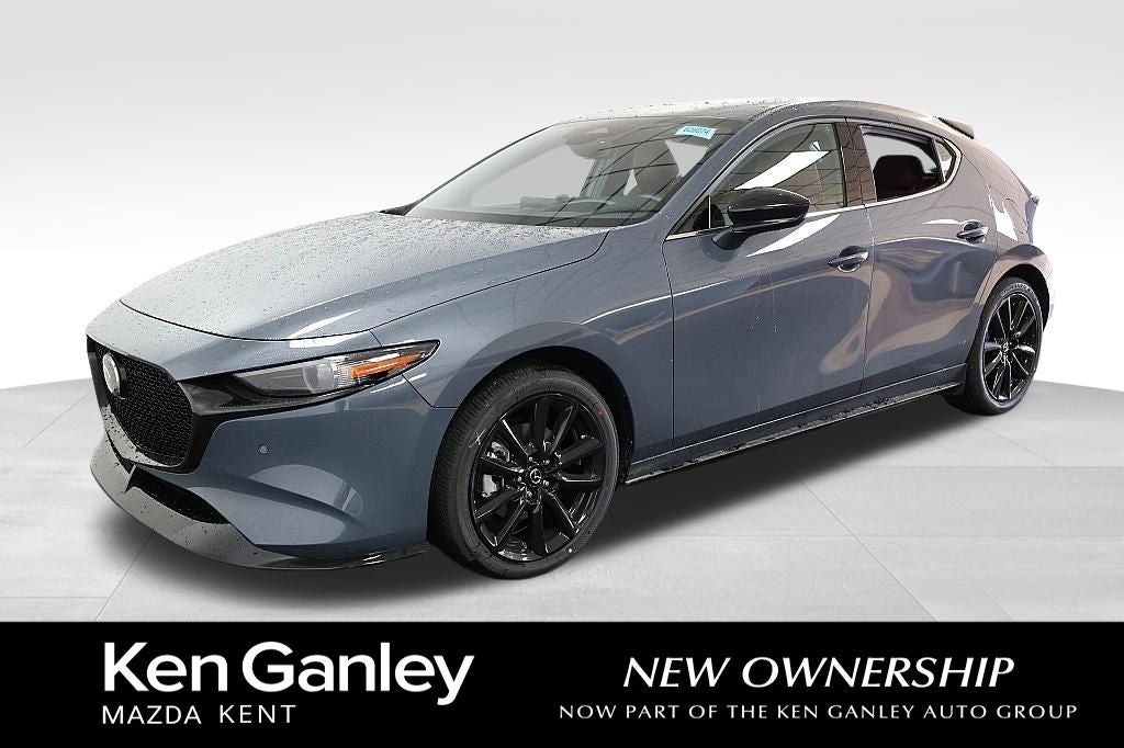 2026 Mazda Mazda3 Hatchback 2.5 Turbo Premium Plus AWD in Polymetal Gray Metallic — front three-quarter view